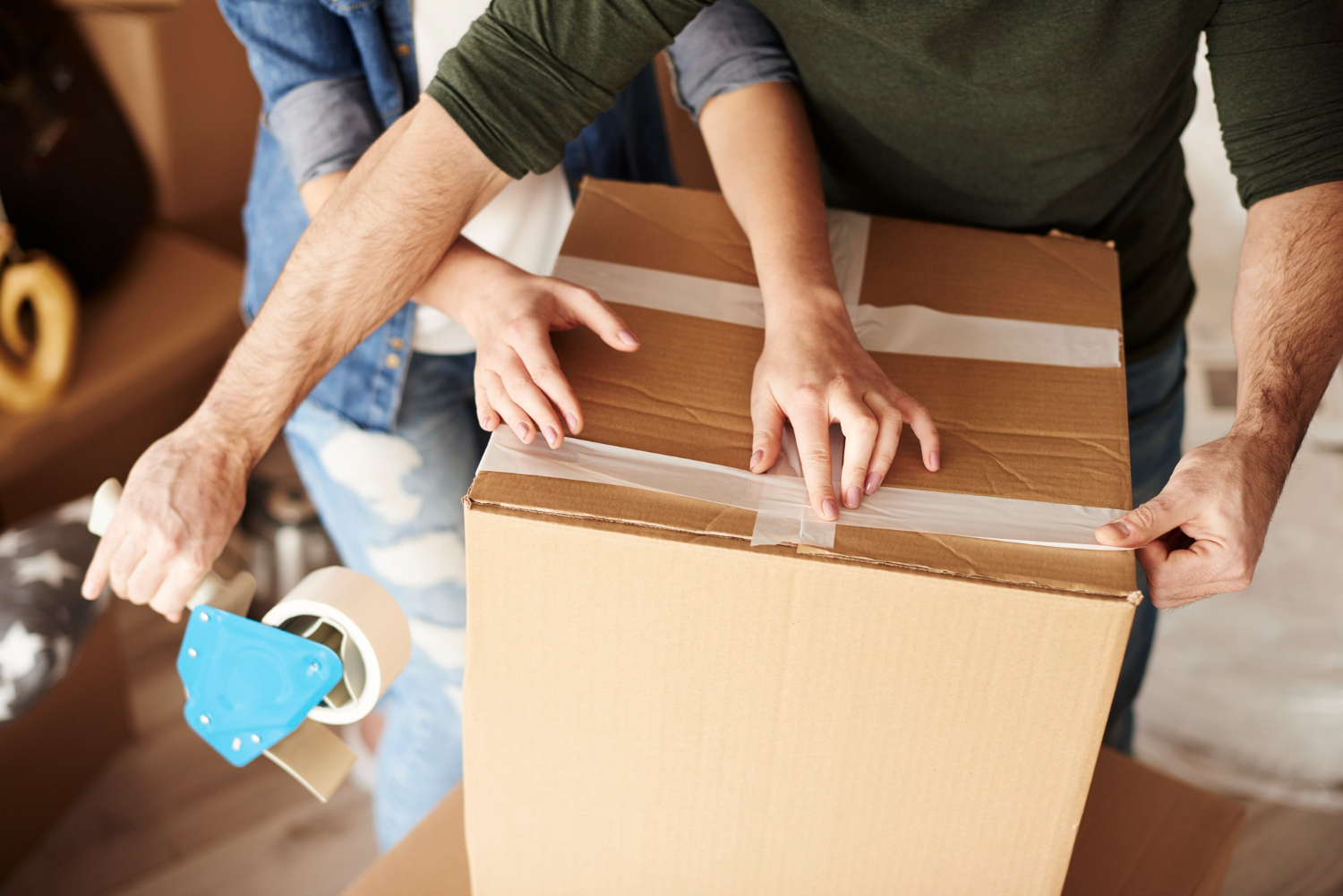 young-couple-unpacking-moving-boxes-new-flat